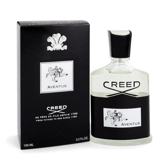 Creed Aventus Eau De Parfum 100ml luxury men's perfume bottle with black presentation box on an elegant dark marble background.